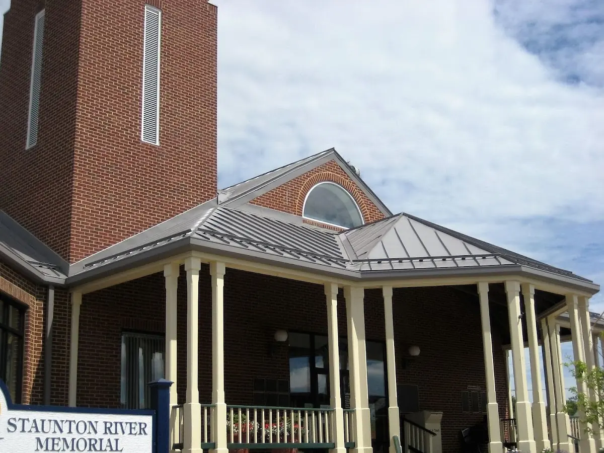 Skilled roofing craftsmen working on a residential roof in Parma